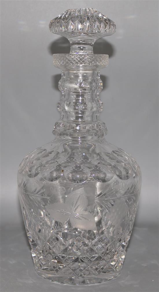 A cut and etched glass decanter